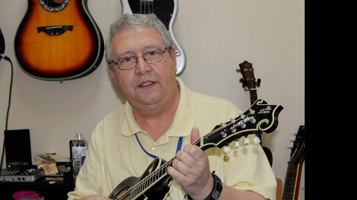 
Joe Hardin, who has been playing stringed instruments all his life, is the owner of Downtown Music Lessons and More in York.
