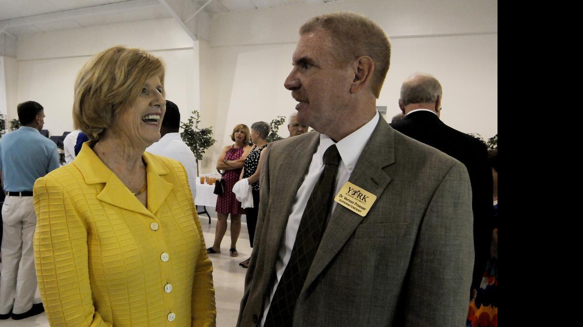
Molly Spearman, state Superintendent of Education, visits with York schools Superintendent Vernon Prosser Thursday during a York and Clover chamber event.
