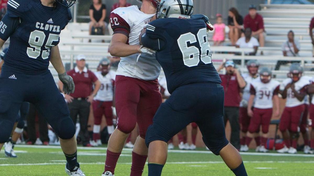 
Clover’s No. 68 Preston Vang blocks for the Blue Eagles.
