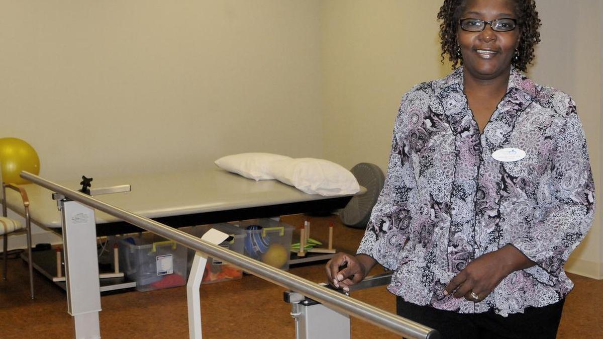 
Deirdre Davis, a physical therapist assistant and rehab manager at White Oak Manor, stands in the new gym and treatment area.
