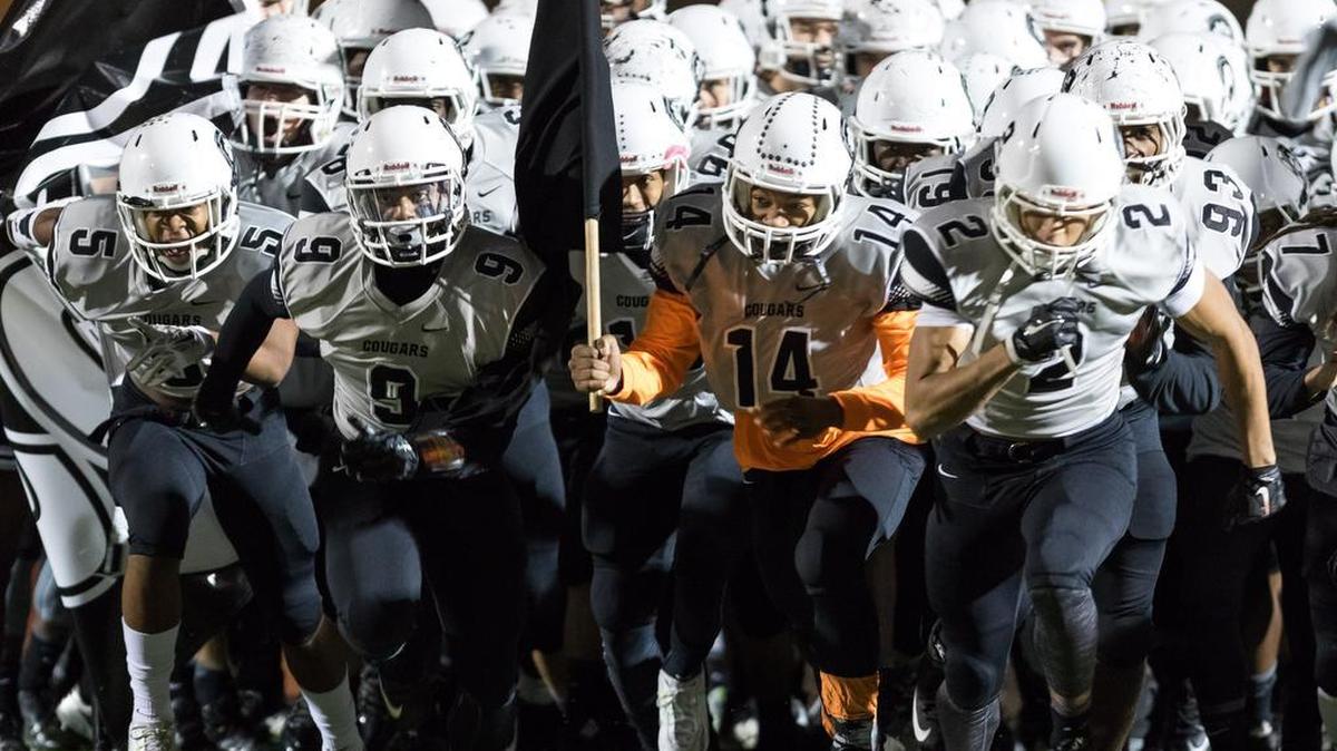 The Cougars run onto the field Friday as York hosted Nation Ford in Class 4A Division II playoff football.