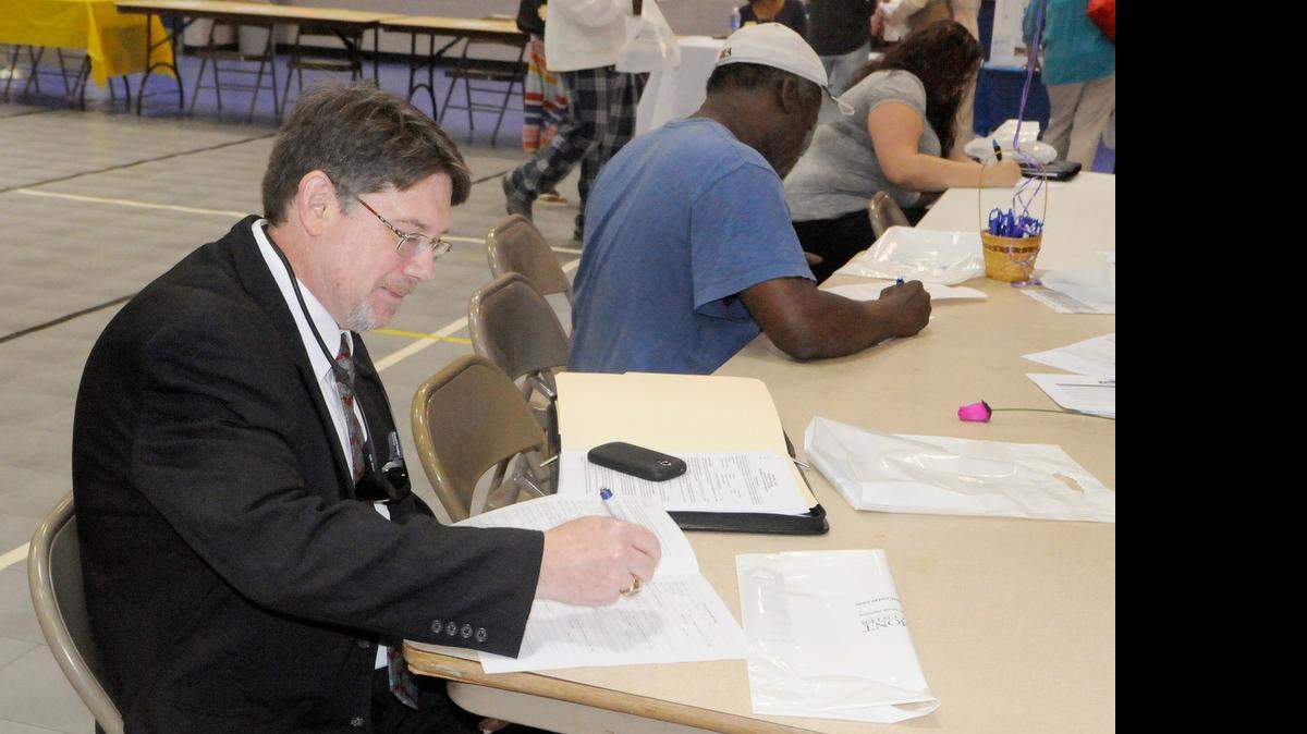 
Doug Hurst of York fills out an application during the annual job fair in York on April 23. Hurst has a college degree and experience working with people who have disabilities.
