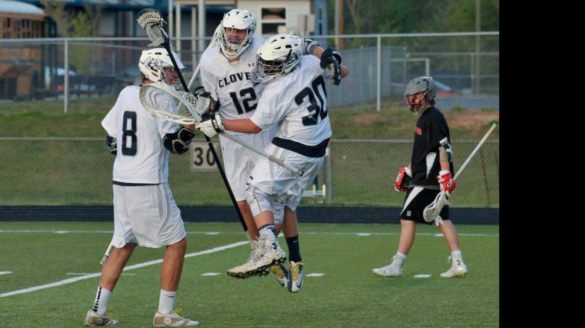 
Clover’s Aaron Coble, from left, Nick Jakab and Noah Lalli celebrate a point against Nation Ford in last week’s lacrosse playoff match at Clover. The Blue Eagles defeated the Falcons 10-8.
