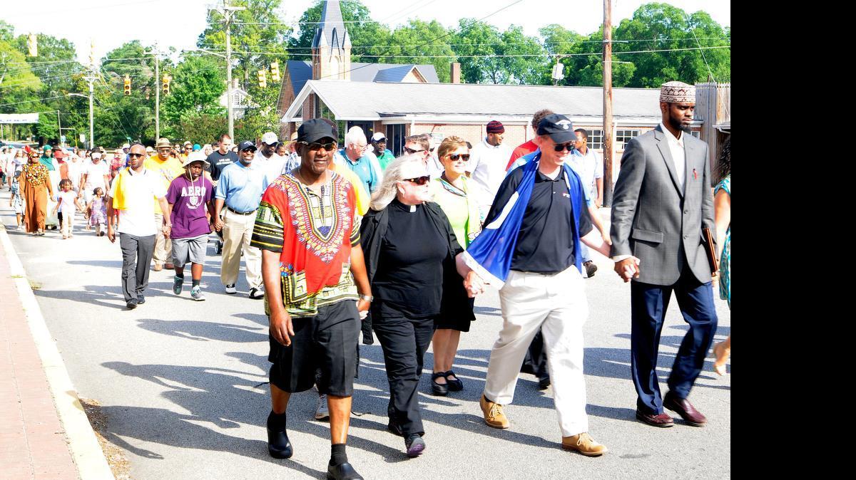 
Marchers of different races, faiths and cultural backgrounds walked together during a peacekeepers march Thursday in downtown York.
