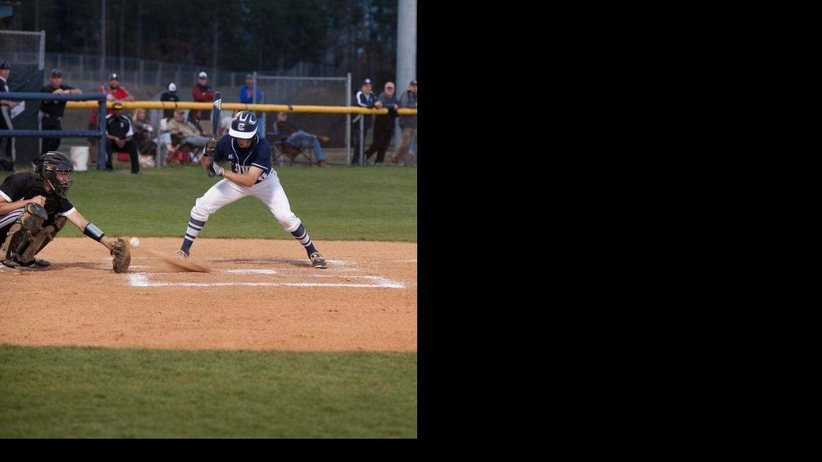 
Clover’s No. 6 Cole Hybarger attempts to bunt the ball but gets a strike instead in the game against York.
