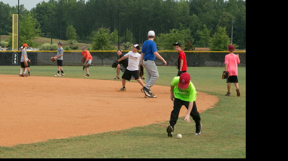 
Children ages 7 to 12 practice their baseball skills during a camp last week.
