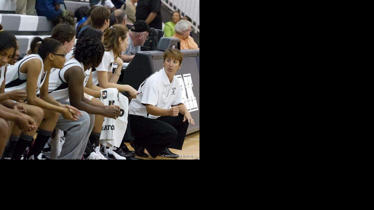 
Coach Paula Blackwell, far right, talks to players on the York Comprehensive High School basketball team.

