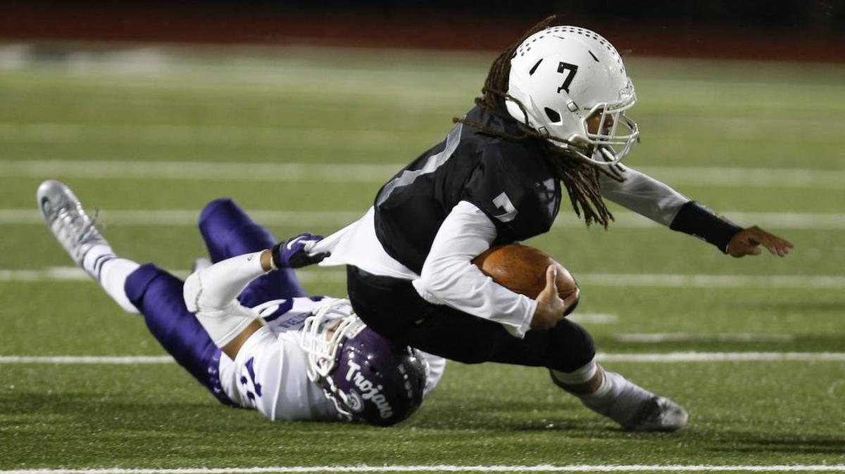
York quarterback Wally Wilmore is taken down by Northwestern’s Miles Corprening Friday.
