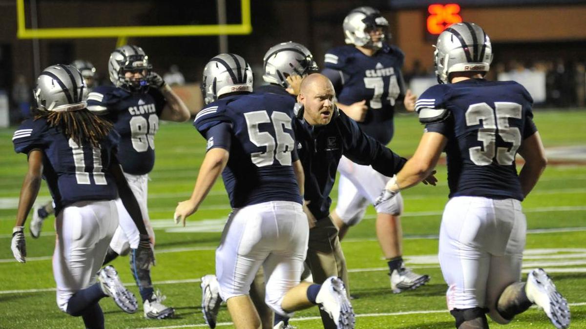 Clover players run on the field during the York and Clover rivalry game.
