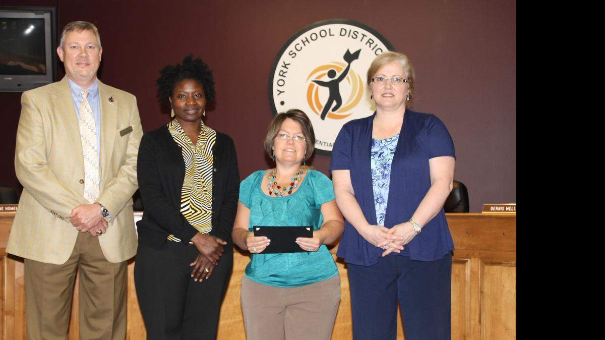 
Donna Fields, a music teacher at York’s Hunter Street and Jefferson elementary schools, third from left, was recognized for her grant. She is pictured with, from left, board member Al Johnson, Jefferson Principal Mattie Hughes and Hunter Street Principal Jane Wallace.
