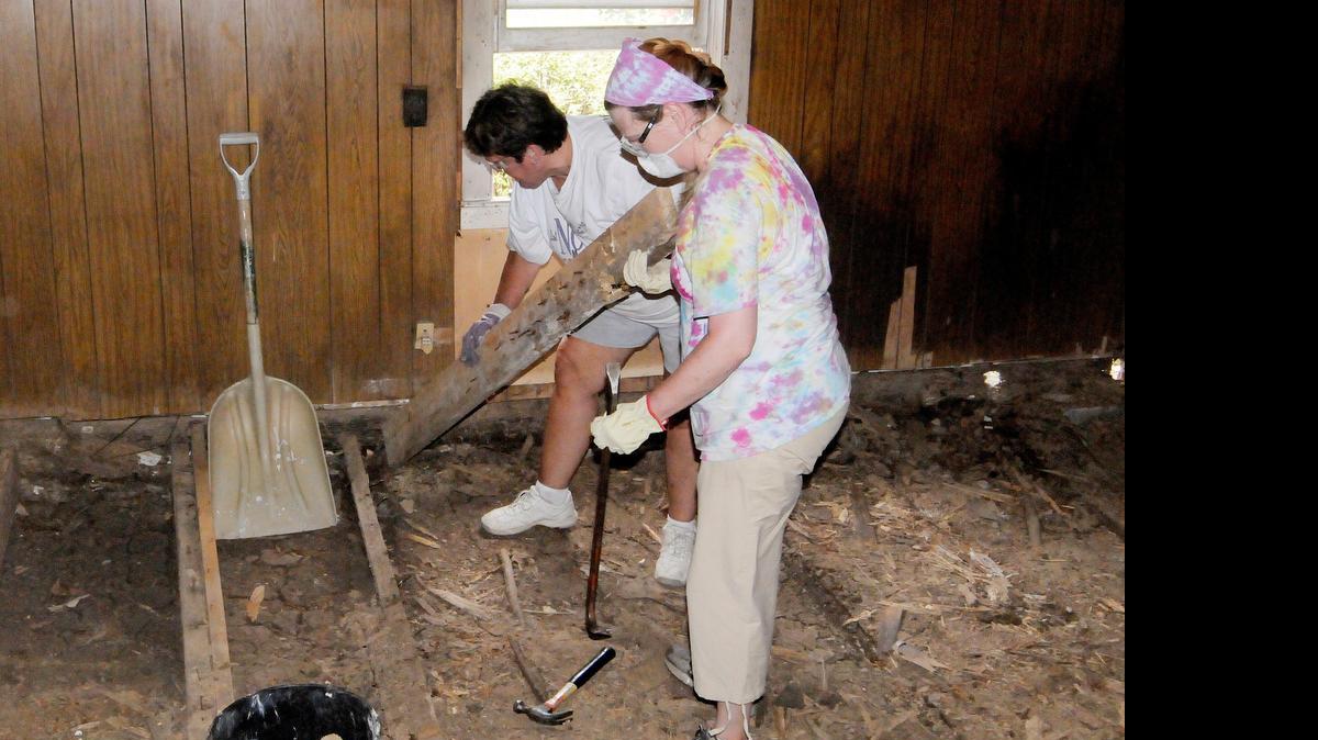 
Madora Stanfield of Saluda, left, and Monica Tilley of Clover remove the floor joists from a home outside Hickory Grove. The group removed and replaced flooring and did other improvements as part of the Salkehatchie mission.
