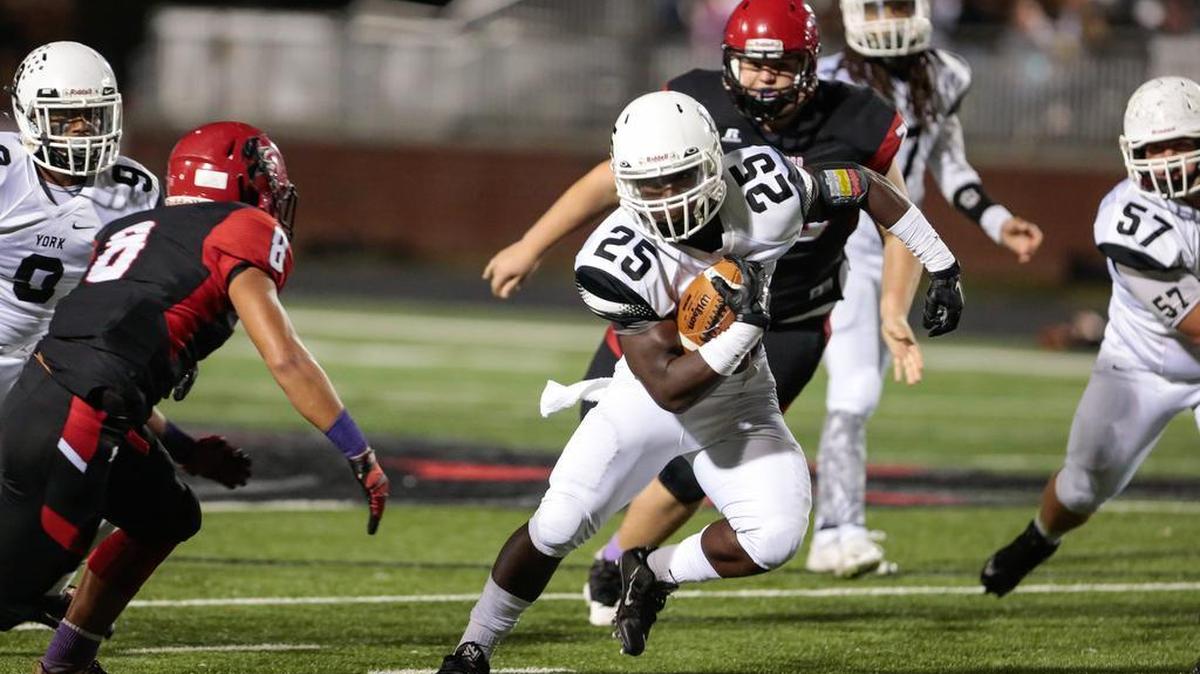 York’s Tyquan McCray carries the ball as the Nation Ford Falcons host the York Cougars in Friday night football.