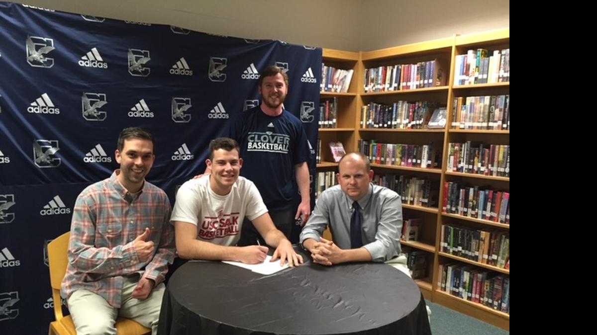
Clover’s Austin Stone has signed with USC Salkehatchie to play basketball. Stone was joined by Clover head basketball coach Bailey Jackson, right, and assistant coaches Will Plyler, standing, and Mark Loyd.
