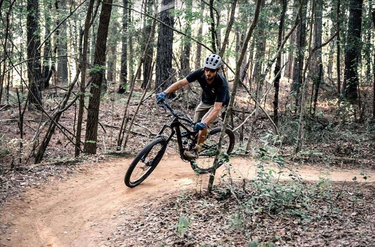 A mountain biker rides on Anne Springs Close Greenway property. A new skills course for mountain biking will open in April at the Fort Mill nature site.