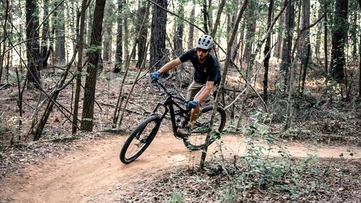A mountain biker rides on Anne Springs Close Greenway property. A new skills course for mountain biking will open in April at the Fort Mill nature site.