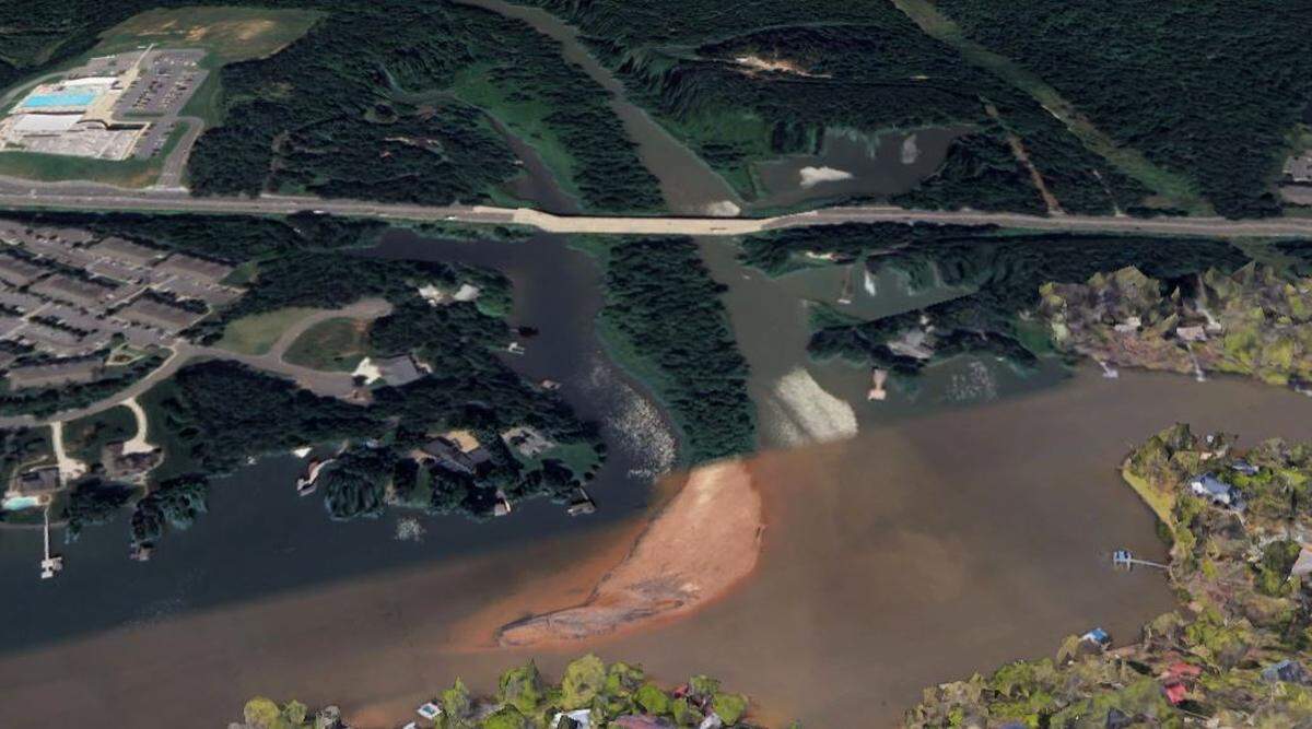 This Google Earth image shows the sandbar that cuts through the middle of Crowders Creek with trees on it, along with new sedimentation.