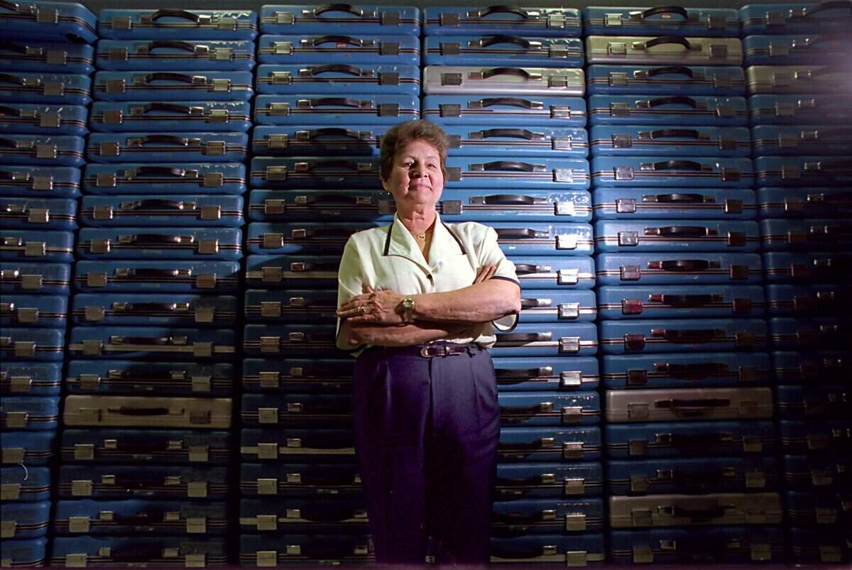 In this file photo from 1998, York County Director of Registration and Elections Betty Whitesides stands in front of stacks of more than 500 voting machines stacked neatly at the E.C. Black Building in York.