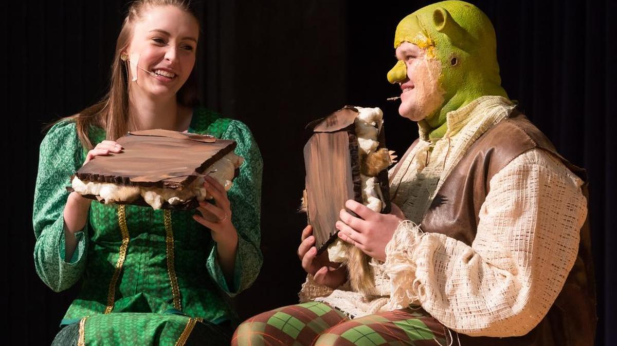 Avery Grace Ingle as Fiona and Cameron Wylie, who plays the title role of Shrek rehearse a scene at Fort Mill High School. Shrek The Musical takes the FMHS stage this week.