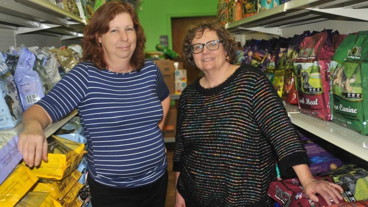 Joanne Styslinger, retail manager at Bright Eyes & Bushy Tails in Lake Wylie, is partnering to donate pet food items with Karen van Vierssen, director for Clover Area Assistance Center.