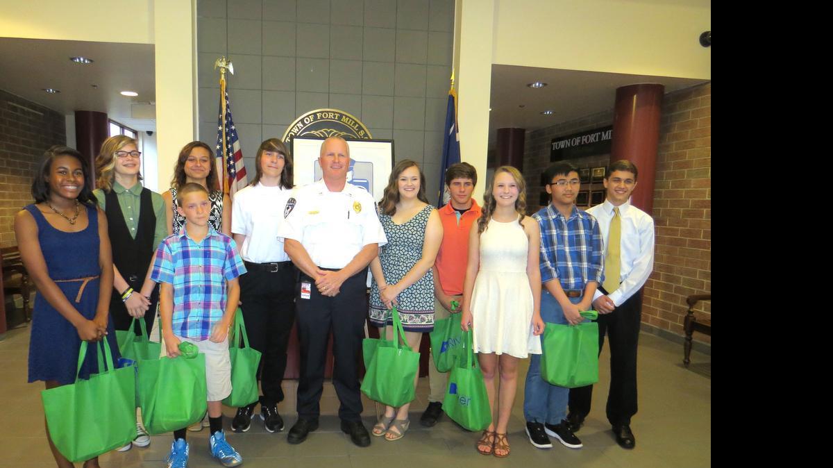 
Do the Right Thing Award winners honored recently at Fort Mill Town Hall are, fromn left: Victoria Robinson, Taylor Cobb, Kyle Shirk, Alexis Vaughn, Nick Graham, Lt. Ray Dixon, Kayla Bivens, Wesley Johnson, Hannah Wells, Tri Nguyen and Nick Greek.
