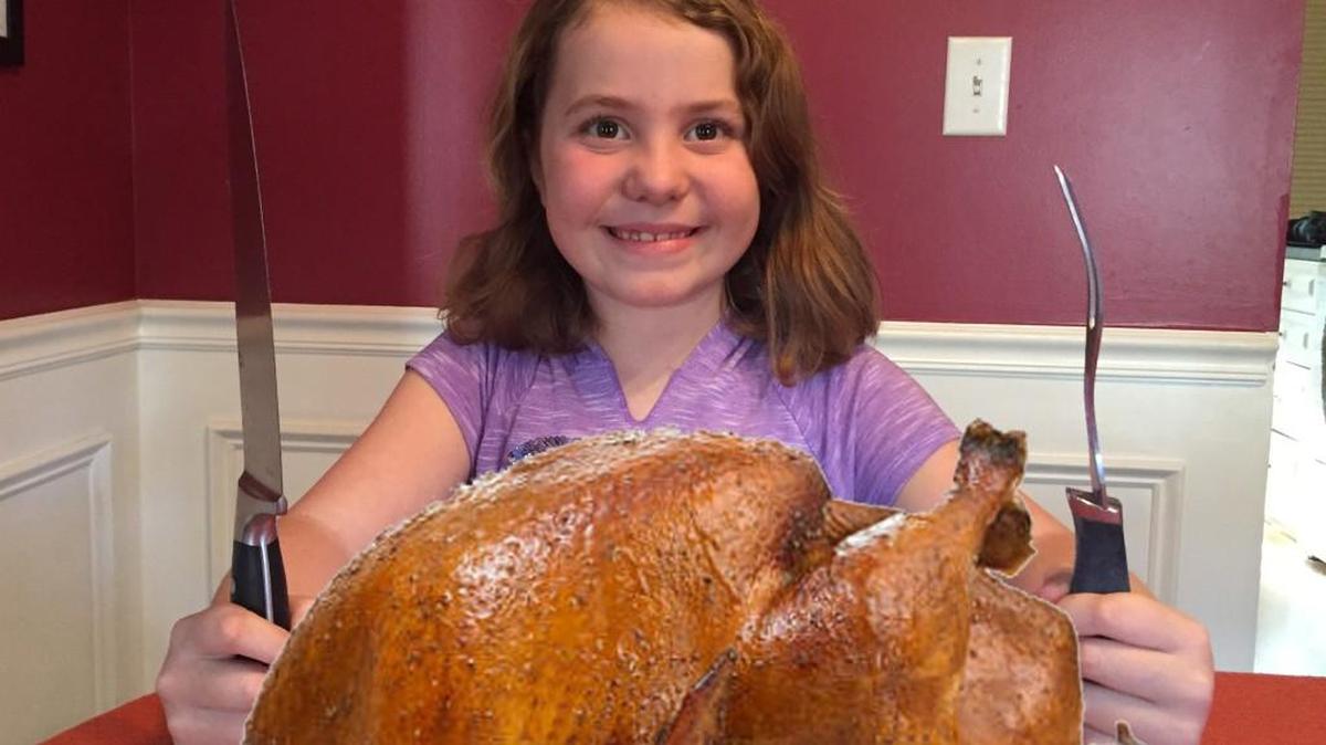Elise Nordgren, 7, of Fort Mill, is one of millions of Americans who look forward to a Thanksgiving turkey dinner.
