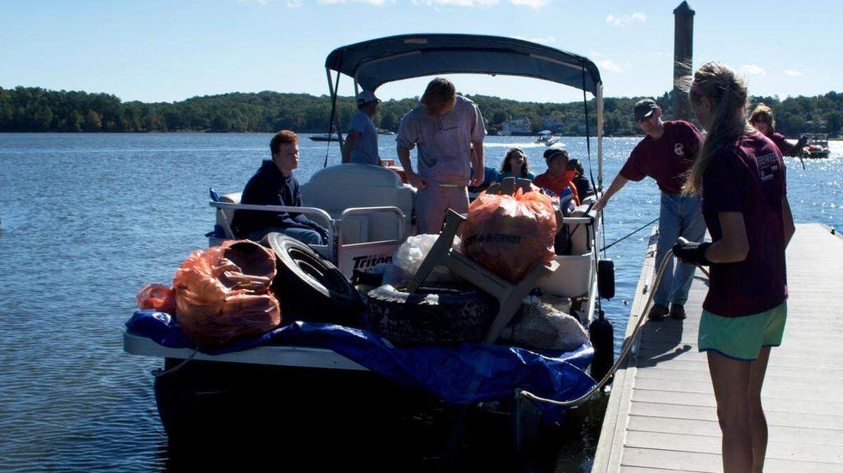Volunteers haul in trash during Riversweep at Lake Wylie on Oct. 4, 2014.