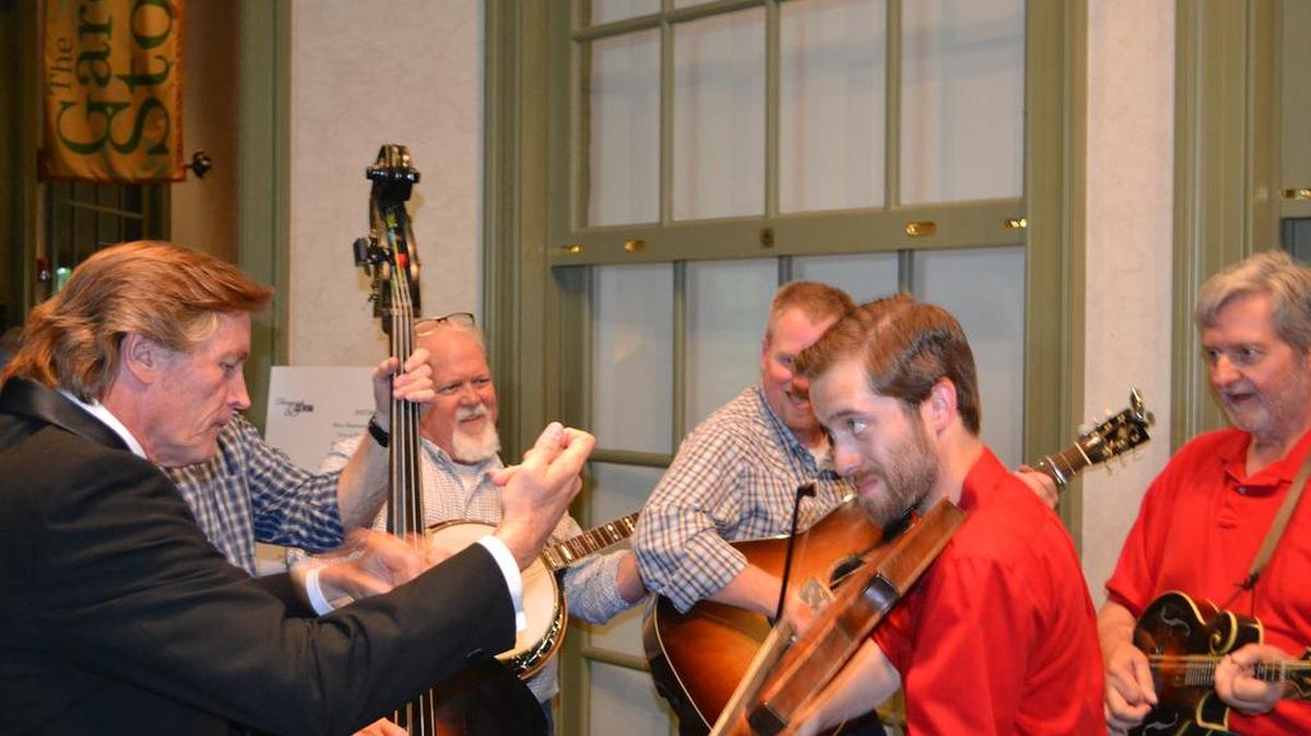 Celebrity guest auctioneer Keith Larson of WBT Radio jumps in with Cottonwood bluegrass band during Clover Area Assistance Center’s Annual Gala April 21 at Daniel Stowe Botanical Garden in Belmont.