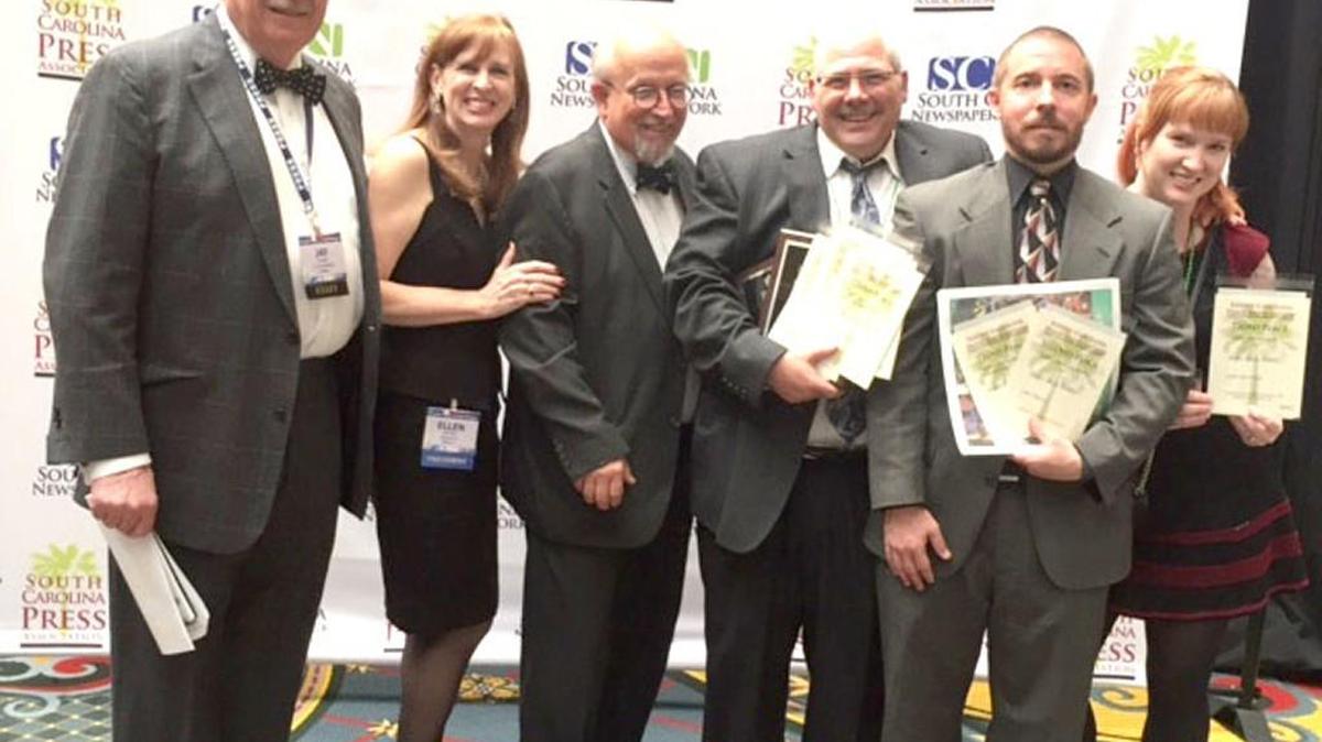 The South Carolina Press Association held its annual meeting and newspaper contest awards presentation March 17-18 in Columbia. Shown here, from left, are SCPA attorney Jay Bender, President Ellen Priest, Director Bill Rogers, Fort Mill Times Editor Mike Harrison, sports correspondent Mac Banks and correspondent Melissa Oyler.