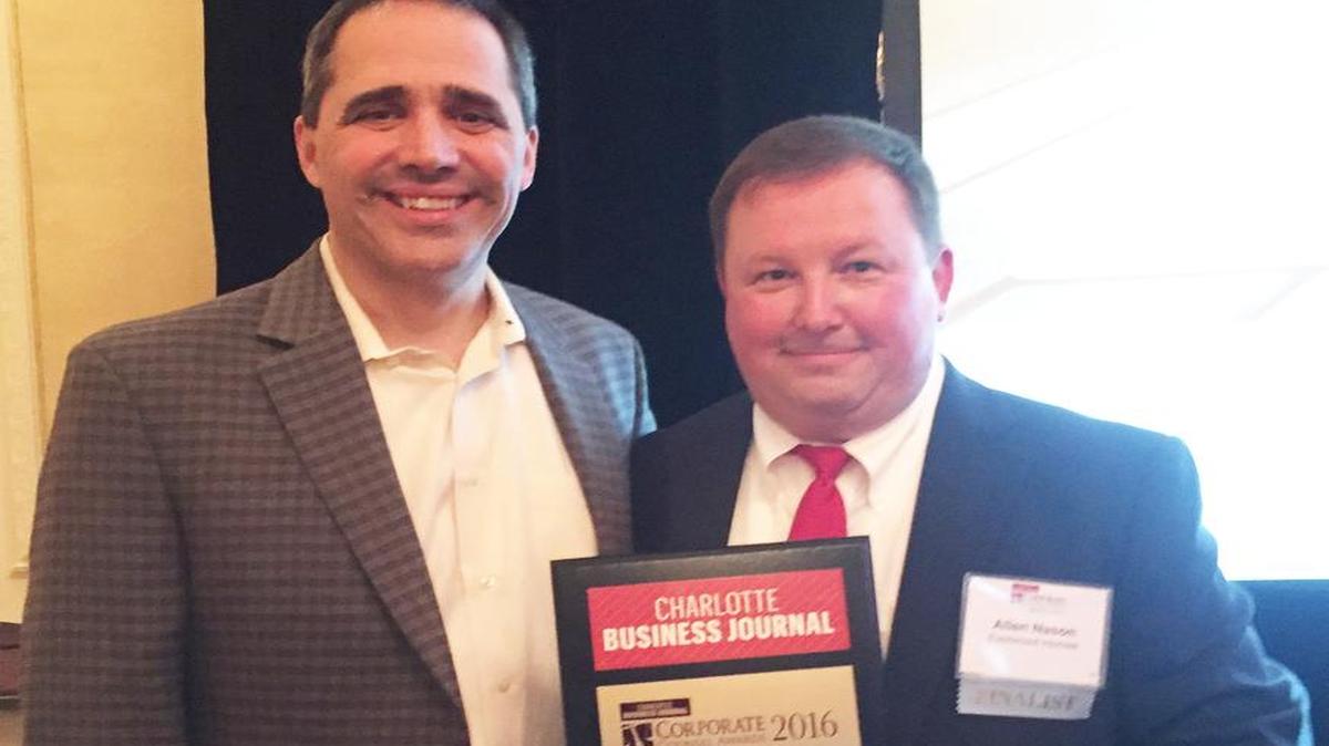 Mike Conley, senior vice president of Eastwood Homes, left, stands with Allen Nason of Lake Wylie, who was named 2016 Solo General Counsel of the Year by Charlotte Business Journal for his work with Eastwood Homes.