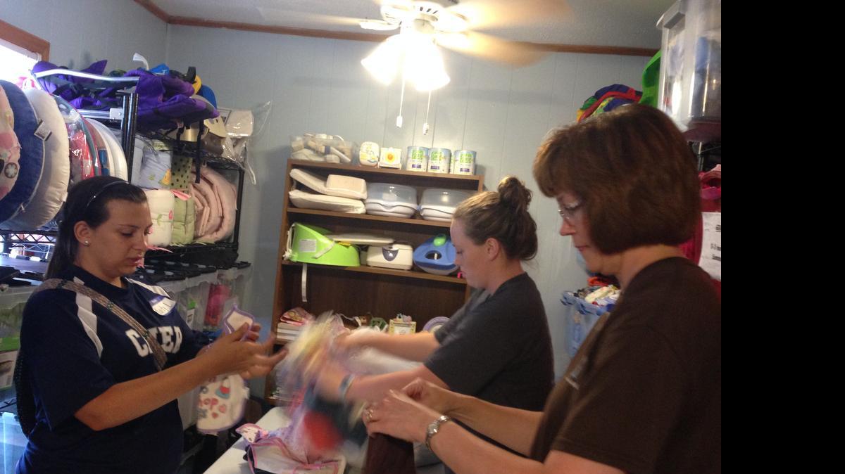 
From left Kaity Little, Vanessa Van Slambrook and Martha Park help June 17 at Palmetto Pregnancy Center in Lake Wylie as part of a mission project for River Hills Community Church youth group.
