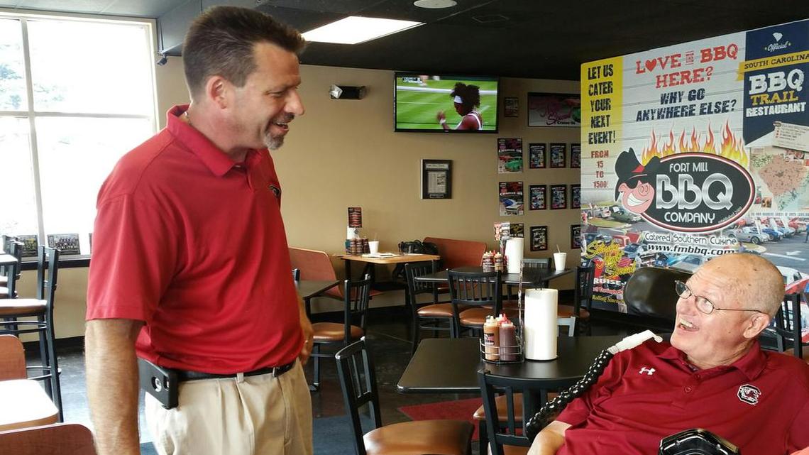 
Fort Mill BBQ Co. owner Bob Bowman, left, talks with customer Larry Jackson. Interacting and building relationships with regulars is what Bowman says he enjoys most about owning a local restaurant. Fort Mill BBQ Co. is on the Carolina Barbecue Trail. 
