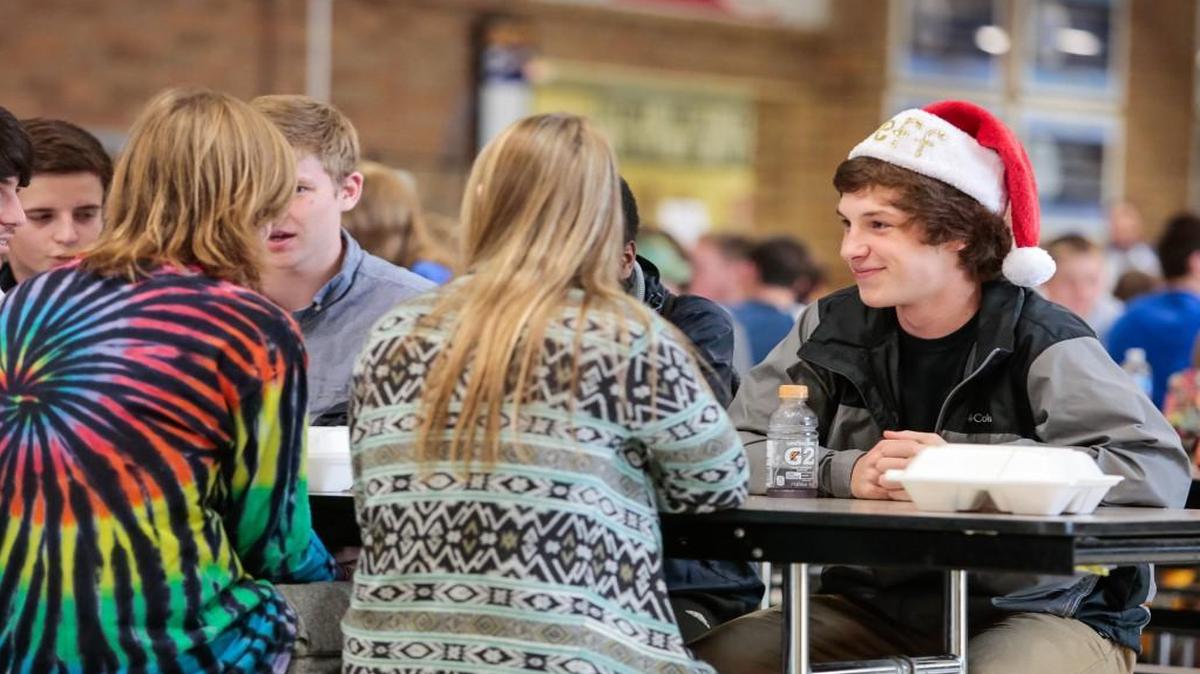 Srudents eat lunch at Fort Mill High School recently. The district is looking to hire more workers to help meet nutrition standards.