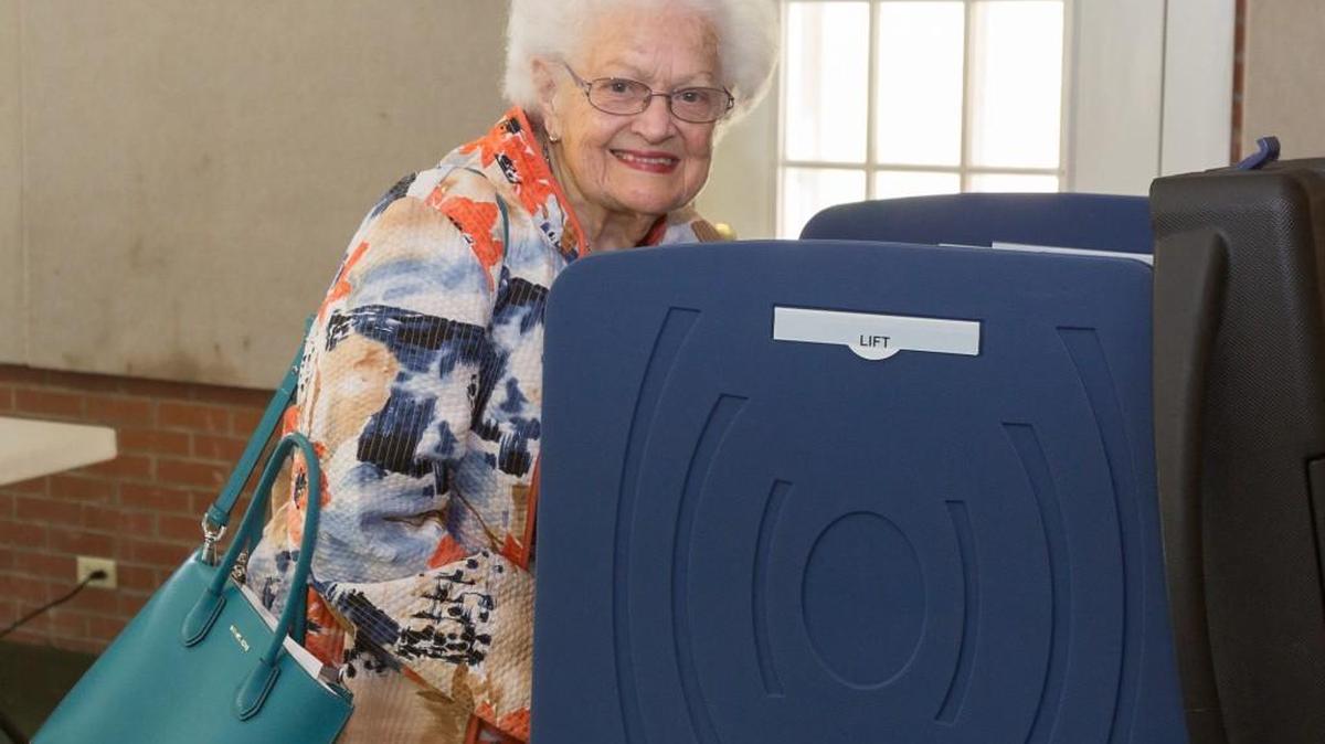 Long time resident Eloise Williams smiles after casting her vote as the new town of Van Wyck holds it's first election Tuesday.