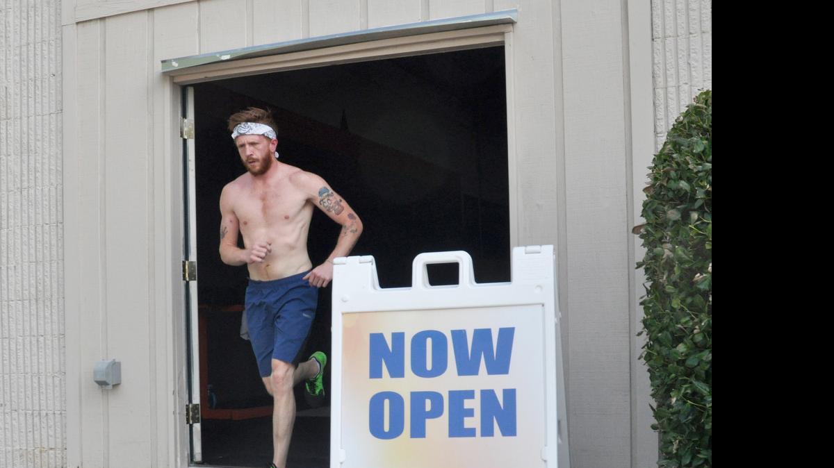 
Jesse Freeman of Gastonia runs down the ramp out of the new CrossFit Lake Wylie location at 4090 Charlotte Highway during a Thursday morning workout.
