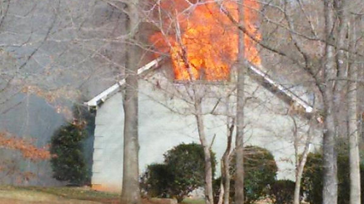 Jim Davis of Lake Wylie saw a house fire Tuesday while fishing on the lake off the main channel.