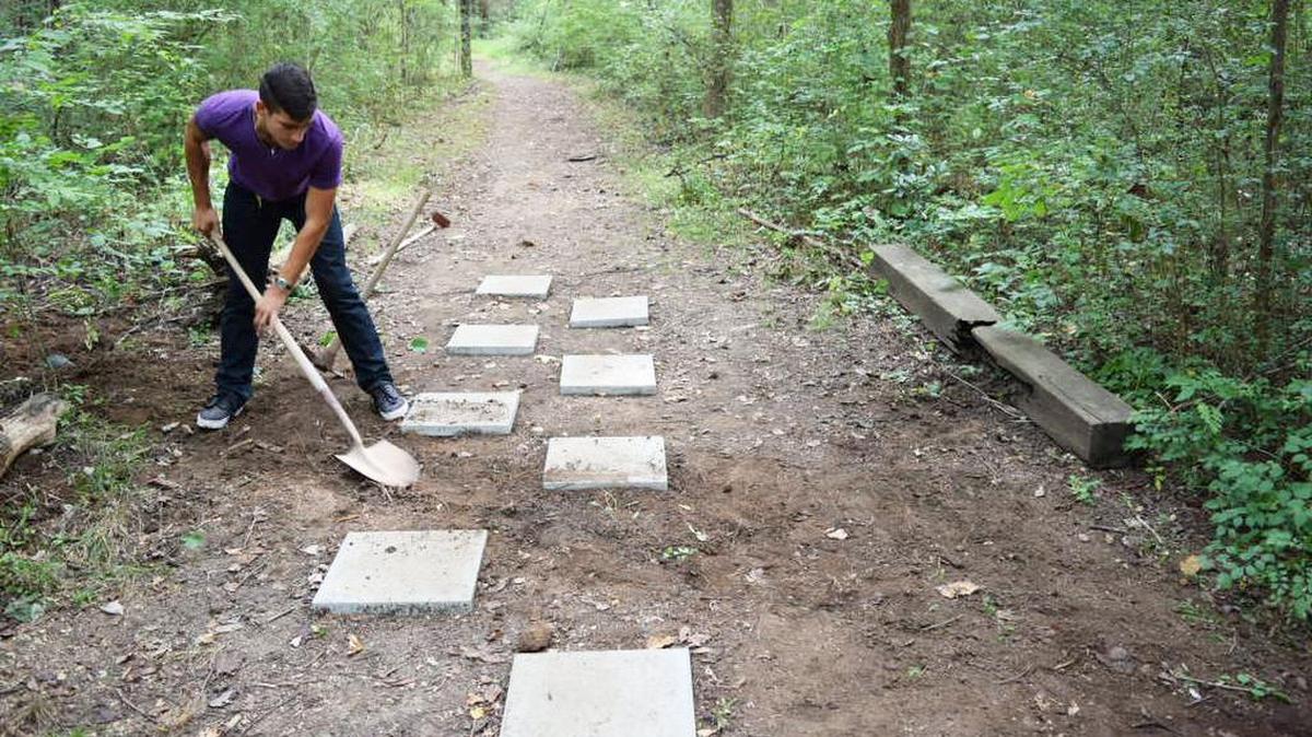 
James Kyle Johns of Boy Scout Troop 45 renovated three outdoor classrooms and a walking trail for Steele Creek Elementary School. 
