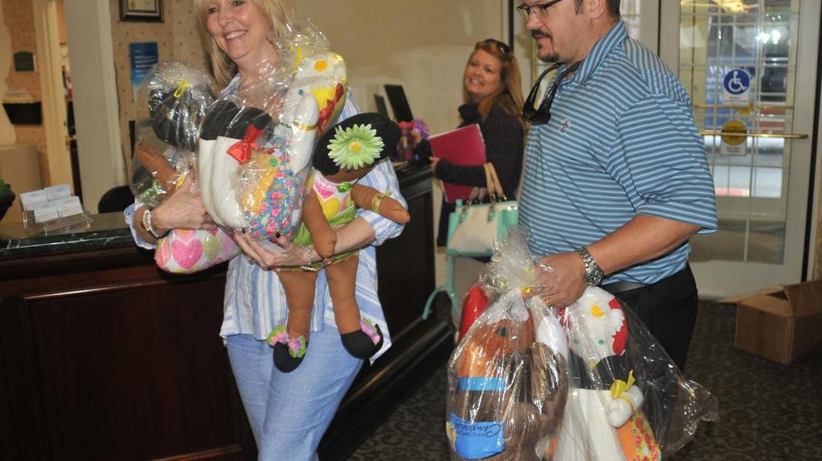 Janet Tompkins and J.C. Ajemian deliver the Comfort Companion dolls donated Thursday by Relevant Church in Lake Wylie.