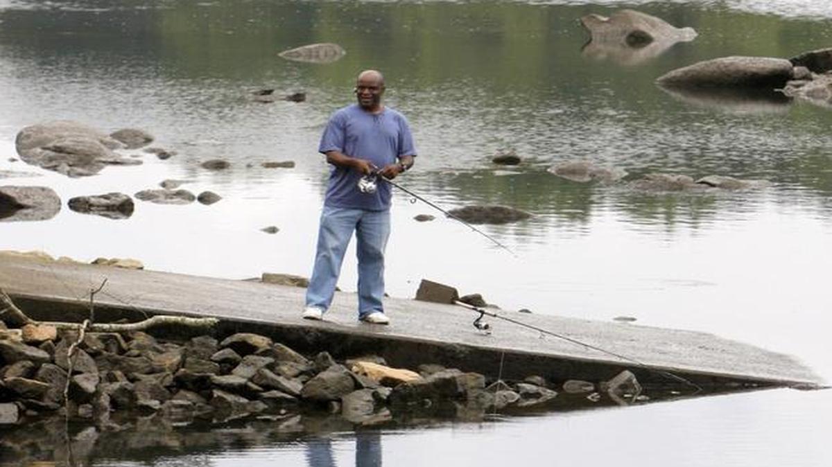 James Noaks of Lancaster fishes at the Fort Mill access area on the Catawba River below the Lake Wylie Dam. The park is one of several Duke Energy wants to improve once it gets federal approval.