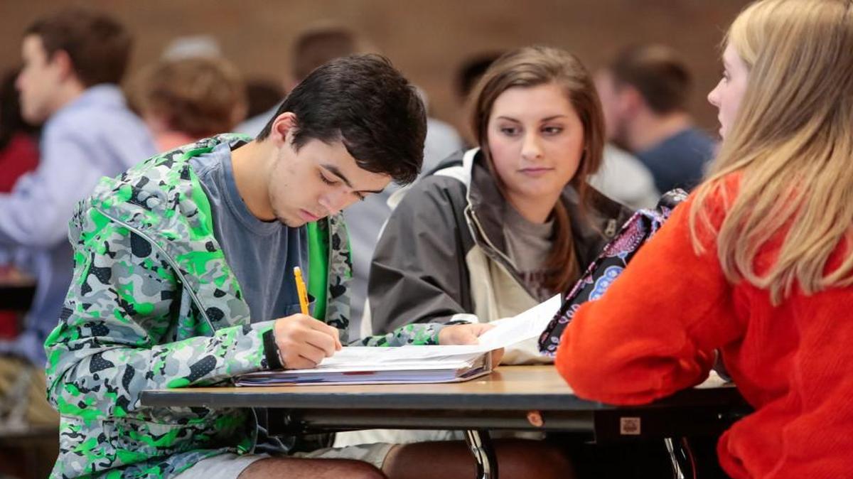 Heath Pratt spends time working on his U.S. history during FLEX lunch at Fort Mill High School Thursday.