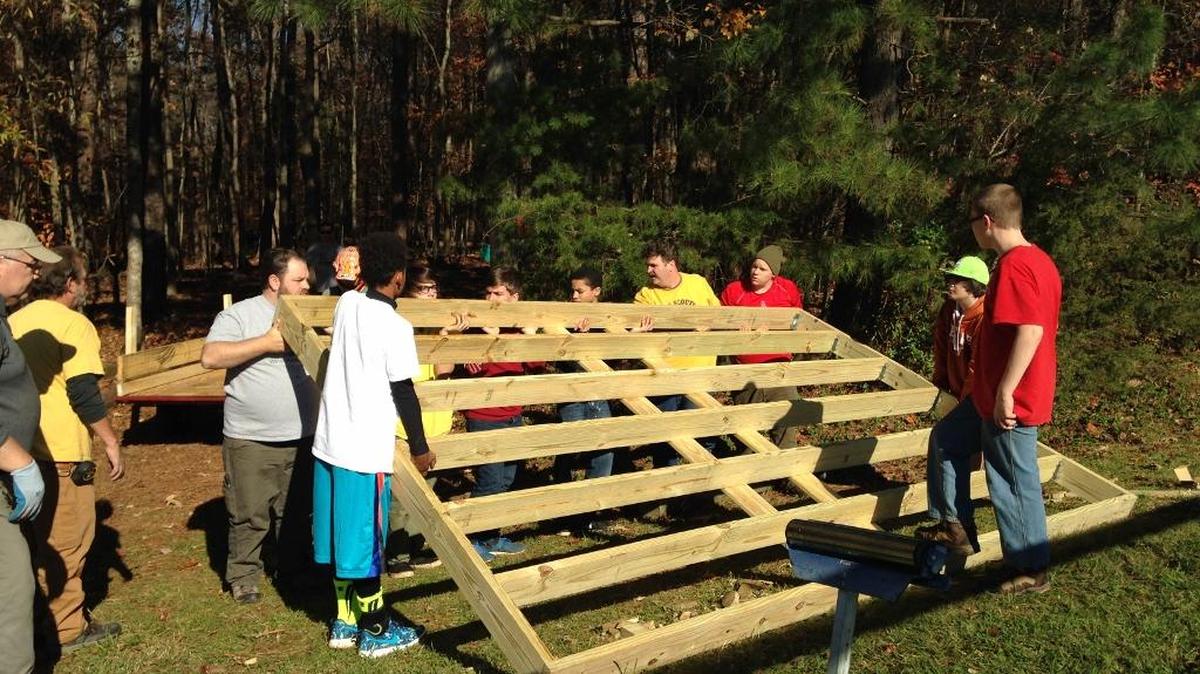 Scouts lift the frame for the Whale Watch station as part of Harry Snow’s Eagle Scout project at York Middle School.