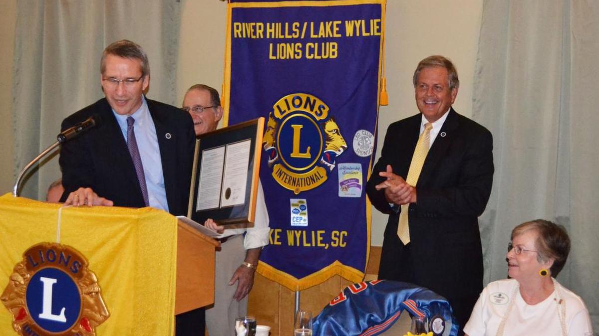 
Speaker Pro Tempore Thomas E. “Tommy” Pope congratulates the River Hills/Lake Wylie Lions Club on their 40th anniversary with Rep. Ralph Norman during the 40th anniversary celebration Sept. 1 at River Hills Country Club.
