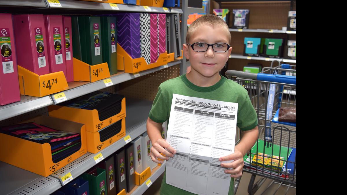 
Aiden McDonald, 7, goes back-to-school shopping July 9 at Walmart in Indian Land with his grandmother.
