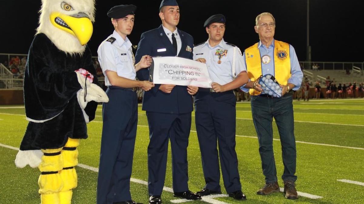 From left with the Clover High School Blue Eagle mascot are AFJROTC cadets Daniel Cole, Phillip Rector and Josh Phillips presenting golf balls to River Hills/Lake Wylie Lions Club Lion Len Fleet.