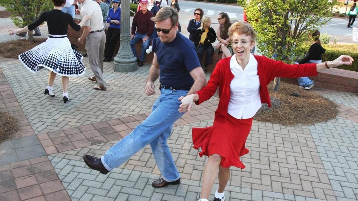 Denise and Joe Polsgrove of Fort Mill dance at the Cruise In and Sock Hop in the Old Town Amphitheater at Rock Hill City Hall during last year’s Come-See-Me. In the background Jeff Greene and Robin Stalsby from Charlotte dance. Both couples were giving dance demonstrations.