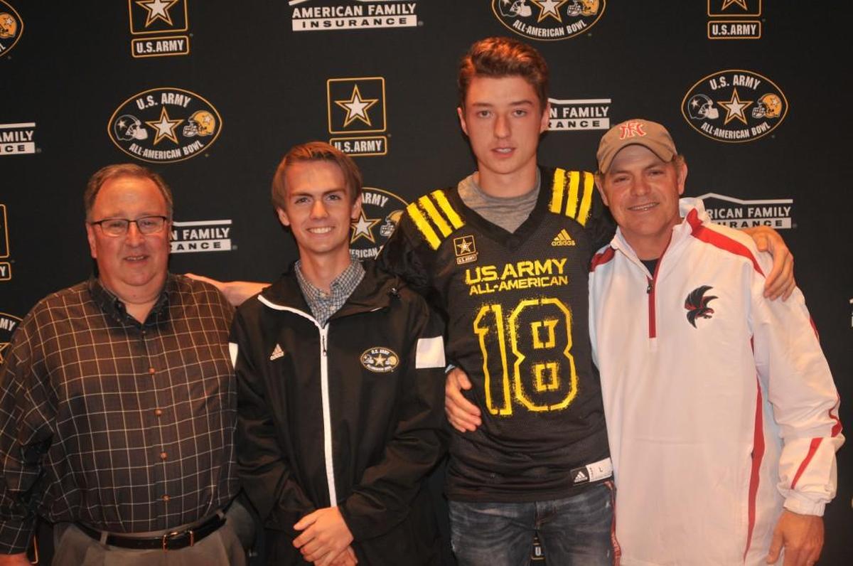 Then Nation Ford High School band director Martin Dickey, marimba player Todd McKinney, punter Skyler DeLong and football coach Michael Allen celebrate McKinney and DeLong being named U.S. Army All-Americans in this Herald file photo.