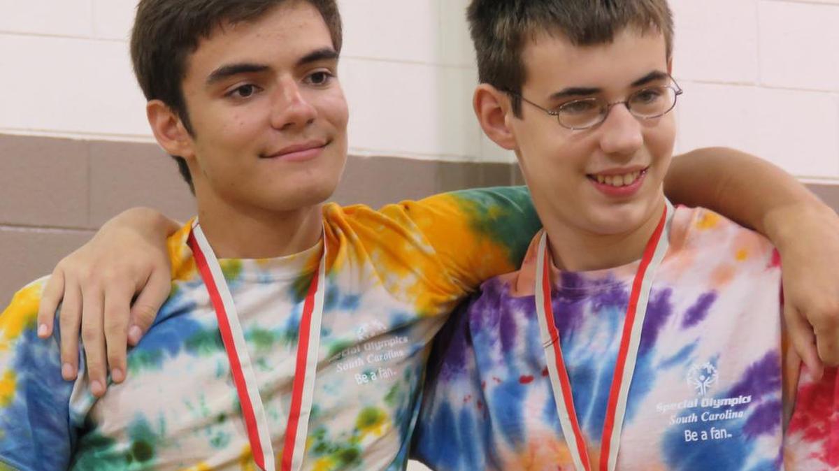 
Clover High School Special Olympics Unified bocce team members Scott Thalacker and Special Olympics athlete Sevy Mason wear their medals after winning in Rock Hill.
