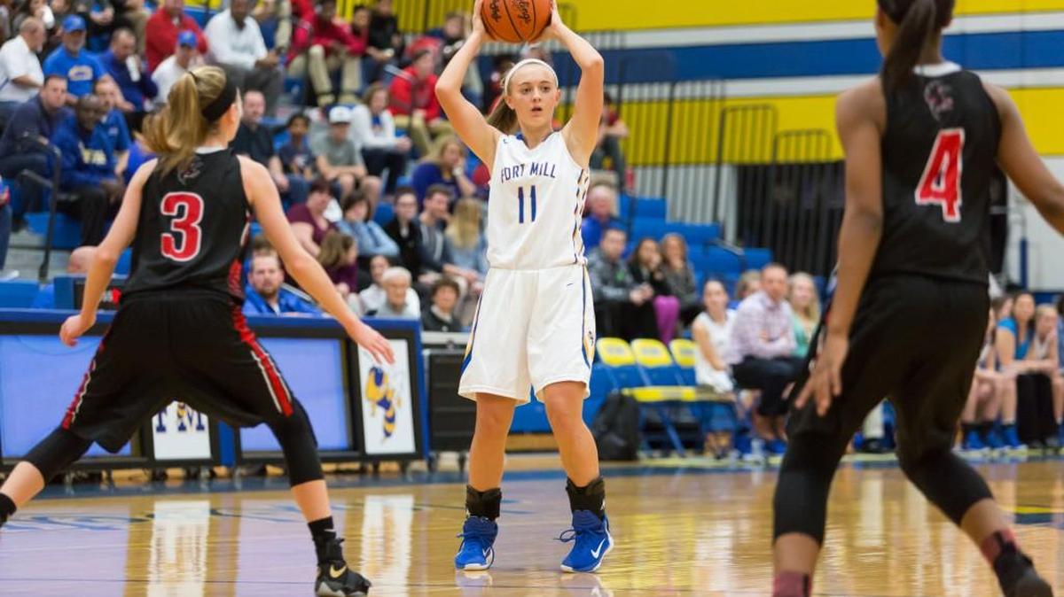 Fort Mill's Kimber Haley looks to pass as Fort Mill girls hosts Nation Ford in girls’ basketball.