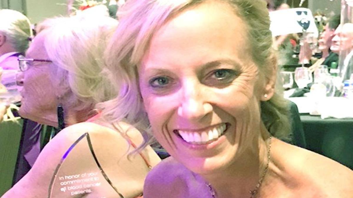 Amy Eberhardt of Indian land holds the Citizenship Award for Volunteerism she received from the Charlotte Chapter of the Leukemia & Lymphoma Society. She raised more than $100,000 for the cause.