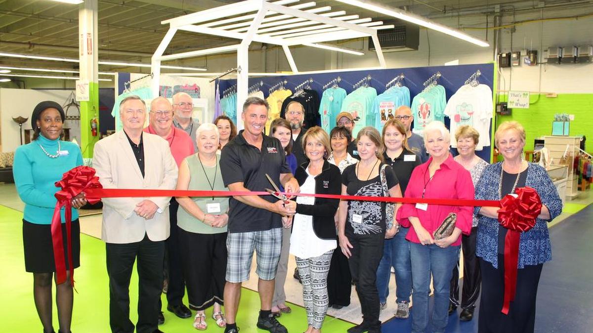 Emory and C.J. Vandiver cut the ribbon with Belmont Mayor Charlie Martin, staff members, vendors and Montcross Area Chamber representatives. Board chairwoman Melia Lyerly, right, holds the ribbon with former chamber secretary Delta Sanders.