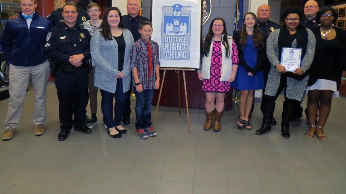 Honored at the Do the Rght Thing Awards were, from left: Jack Stajos, Officer Johnathan Gilbert, Officer Tony Wilkins, Dylan Rothbauer, Laine Collins, Lt. Ray Dixon, Shane Dorn, Savannah Nelson, Maggie Hays, Sergeant David Bivins, Tajia Dawson, Officer Scott Johnson and Amaya Britton.